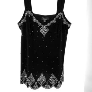Women’s black top with silver embellishments.